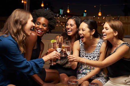 Group,Of,Female,Friends,Enjoying,Night,Out,At,Rooftop,Bar